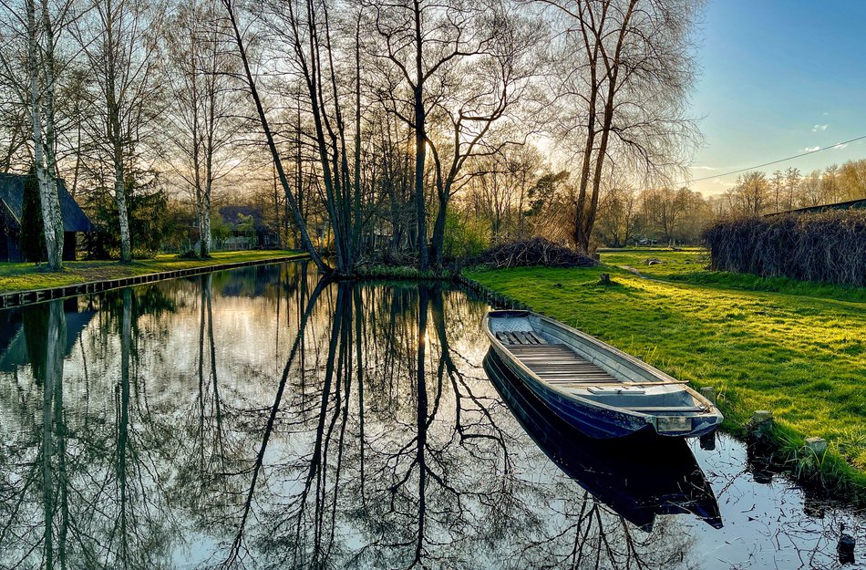 River Spreewald and boat in the foreground lying on the right side at the edge