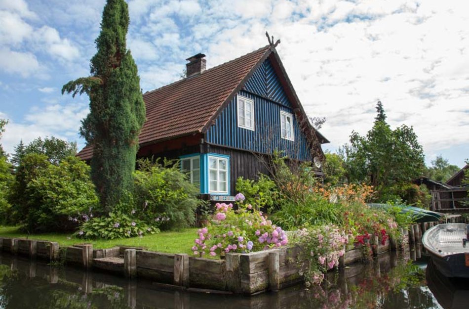 Beautiful green house on the river Spreewald